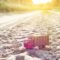 Toy retro truck on the road - symbol of cargo transportation